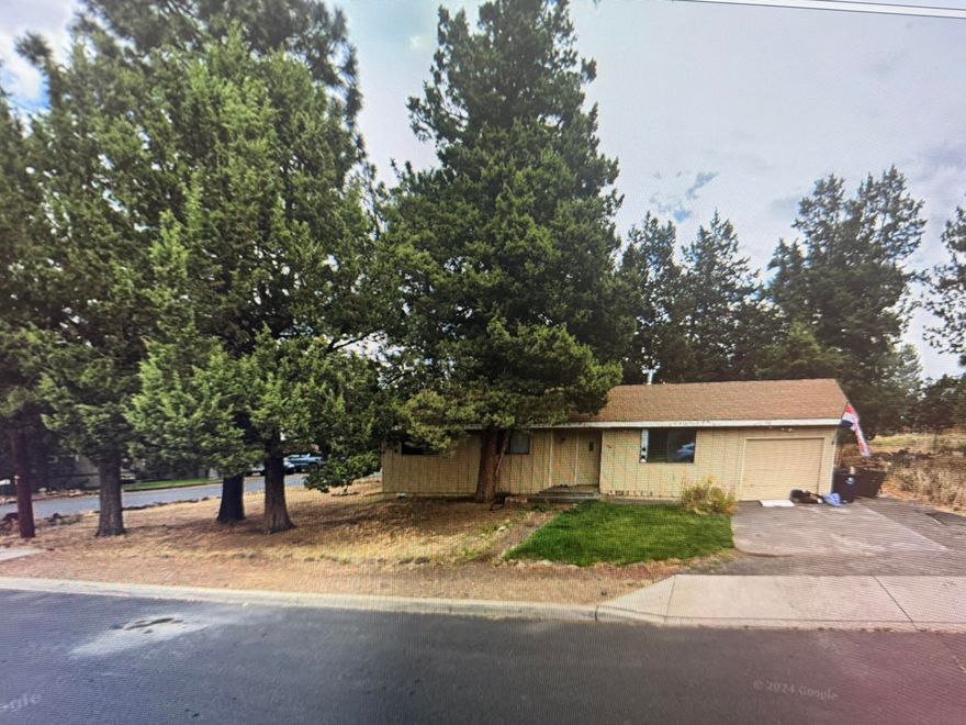 Location Location Location, This home is located in Beautiful Bend Park near the Mill District and the Deschutes River. This 3 bedroom home with attached garage is located on a corner lot in a beautiful well established neighborhood.  The home features newer appliances and a large yard just waiting to be landscaped.  This home is priced for a buyer to update and make it the perfect dream home.