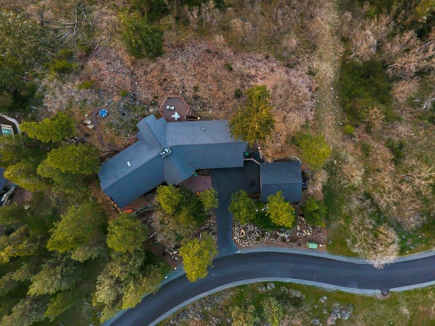 Incredible panoramic views of Klamath Lake, Mt Scott, Crater Lake and surrounding mountains from this custom built home. Framing this scenic view are very expansive high end custom energy efficient low maintenance wood windows and doors. All rooms have beautiful views. Enjoy the outdoors while on the wraparound redwood decks and hot tub. This three bedroom one level home is located at the award winning Running Y Ranch Resort in Southern Oregon featuring an Arnold Palmer golf course, nature trails, lodge, restaurants, sports center with gym, indoor pool, tennis, pickle ball ice skating, and horseback riding. This property is a car collection dream, with four oversized garage spaces with cabinets and workbench. Too many upgrades to mention. This home is offered turnkey with all furniture, appliances, beds, etc. included. Personal items remain with the owner.