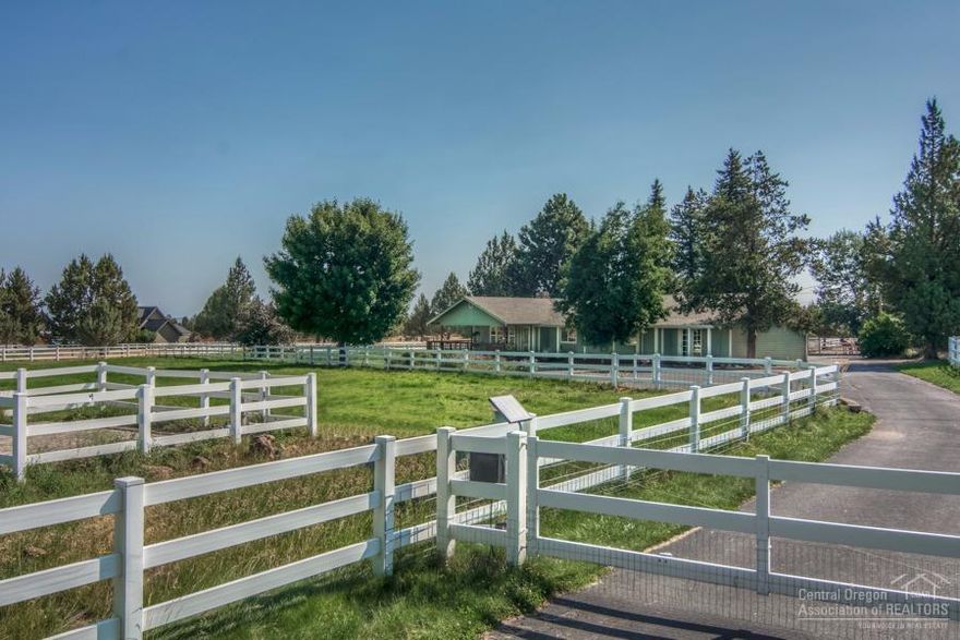 Beautifully cared for and just minutes to town, striking the perfect balance of country living w/ modern conveniences. Flanked by public lands, this peaceful setting has Cascade views, lush pastures, 2 barns, turnouts, and cross fencing. One level home features a guest suite/2nd master. Sunny kitchen has breakfast bar, ample counter space and storage. Clean up is a breeze in the mudroom/utility. Gorgeous cherry cabinetry & extensive solid hardwood flooring. All this on a quiet, paved, dead end street.