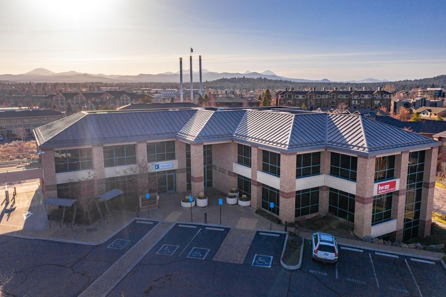 The Cascades Building is one of Bend, Oregon's premier Class A office buildings. Built in 2003 with steel framing, brick masonry and a metal roof, the building is comprised of 20,456 square feet of office space on three floors. Interior improvements
include an attractive lobby area, twelve finished suites with high-end finishes and elevator access to every floor. The building also has two covered drive-thru lanes that were previously used by First Interstate Bank.

The suite sizes range from 213 square feet to 5,775 square feet. Most suites feature large floor-to-ceiling windows providing plenty of natural light and mountain views.

The building's prominent location in the Old Mill District on the Bond & Wilson roundabout provides excellent visibility and easy access to and from downtown Bend and Highway 97. The location also provides tenants with easy access to the surrounding restaurants, shops and river trail along the Deschutes River.

Contact brokers for Offering Memorandum.