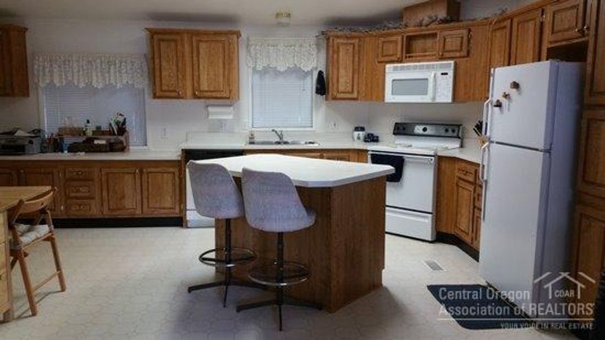 Located in Fox Hills in a desirable SW Bend neighborhood, close to Mt. Bachelor, downtown, & The Old Mill District. This immaculate mobile only is 3 bedrooms, 2 baths, has a open floor plan with vaulted ceilings, lots of windows, large kitchen with island, large master, lots of storage, tandem 2-car carport enclosed on 3 sides, 2 storage sheds, large deck, fenced yard with mature trees, also includes washer/dryer & fridge. A Must See!