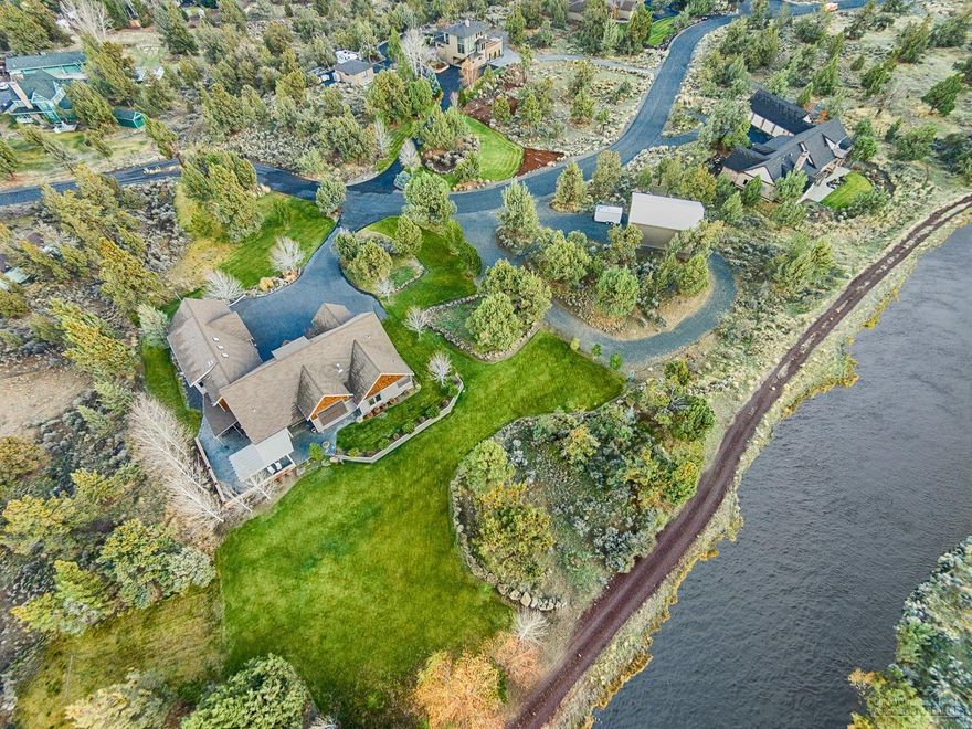 Beautiful upgraded home on the canal w/amazing views! Home sits on 2.8 landscaped acres w/an additional 1.2 acres across Overtree Rd. Gourmet kitchen w/granite counter tops, prep sink, island & lovely hardwood floors. Separate guest suite off bonus room. Spacious main level master bedroom w/spa-like bath including fully tiled shower & jetted, soaking tub. 4 bedrooms & den leaves room for everyone. Lush lawns surround the property. Enjoy the breathtaking sunsets off the patio. Don't miss this fabulous home!