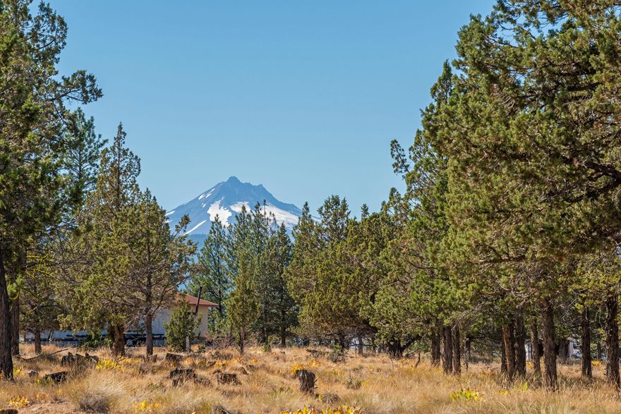 This 5.4 Acre property is located in Three Rivers Recreation Area located on the Metolius Arm of Lake Billy Chinook.  A buildable lot for one to build on or continute camping on as it has been. Enjoy the Mt. Jefferson view from the deck  with a travel trailer and enjoy the camping getaway in the yurt. Bring your boat where you can park it under the 30 x 20 covered shelter.Three Rivers LOA is a completely off grid community and has many ammenities such as an airstrip, pickleball court, event center, private beach/ marina, rec hall, desert golf,  and trails to explore.  Don't miss out on this great opportunity in Three Rivers Recreation Area!