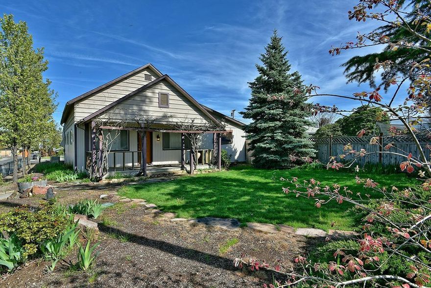 Charming, spacious and great location in the heart of Central Point, you've found it! This cottage style home is walking distance to schools, shopping and a variety of different services. As you enter the home you will be welcomed by a large open living room that makes way into the central family room & into the kitchen w/breakfast bar, walk-in pantry & slider to brick patio. All 3 rooms offer ample space for all of your needs. Laundry is centrally located next to all the bedrooms and bathrooms for convenient access. Bonus room on the backside of the home has limitless potential, turn it into an amazing office space to work from home or customize it into your own game. Plus, an additional 500sq.ft attached shop with a separate electrical panel and street access! This is an opportunity you will not want to miss out on. INCLUDES 1 YR HOME WARRANTY FROM FIDELITY NATIONAL!!