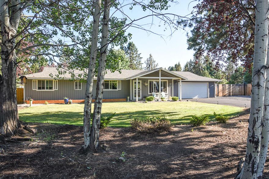 This beautiful turn key single story home on a 1/2 acre lot  in Bend, OR is what you've been looking for! Some of the many upgrades include wood floors, granite counters, cherry cabinets, finished detached office/flex space, fully fenced, landscaped, hot tub, newly paved driveway, new hot water heater and 30/50 amp RV hookup. This large lot provides more than enough room for your RV/boat with room to build a shop.  The owners just connected to sewer as well. This one won't last long! Call today to schedule your showing.