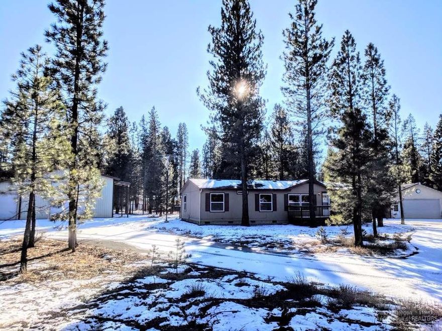 Imagine! A beautiful home, Two Shops and completely redone and turnkey! Very well maintained & cared for 1998 GoodSense Home. New Interior paint, new vinyl plank flooring & trim, carpets and home professionally cleaned. Property has 2 shops, 40 X 36 and 48 X40 per owner (Both permitted), concrete floors and also has 220 power. Treed corner 1.25 acres, fenced with electric gate. So much more.