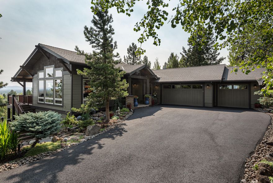 Enjoy panoramic Cascade Mtn. to Ochoco Mtn. views from this beautiful Awbrey Park home. Decks on both levels, flagstone patio, yard space, play structure area (or bocce ball court?) and putting green create the perfect outdoor lifestyle. The new walnut flooring is gorgeous, from the open great room to the main floor primary suite. Casual dining adjacent to the kitchen, plus island seating and a bar make meals and entertaining easy. Downstairs is the bonus room, theater, climate controlled wine cellar, fitness room, and 3 bedrooms. A shed/workshop is attached to the oversized 3-car garage. Fenced dog run, invisible fence, and an idyllic Bend, OR west side neighborhood ... this home has it all!