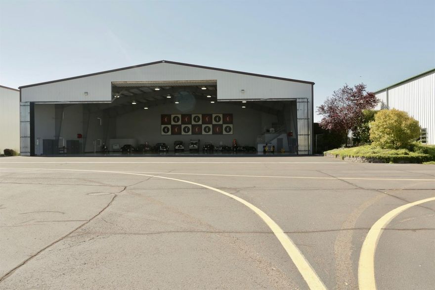 This is an exception opportunity to acquire an exclusive 12,000 square foot hanger at Medford Airport (MFR). As hanger space in the region becomes increasingly tight, this is a unique opportunity to secure a private hanger that could serve a variety of aviation related venues. 12,738 square feet hanger has a high end lobby, office, kitchen, full bath and laundry. 16 secure parking spaces and 46 years remaining on .80 acre land lease. Adjacent 18,000+ square foot hanger at 609 Nebula Way is also for sale MLS#2992707