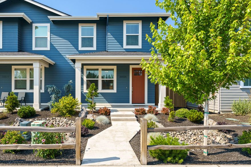 Welcome to this beautifully maintained townhouse in the desirable Countryside neighborhood of SE Bend. Offering 1,704 sqft of comfortable living space, this home features 3 bedrooms, 2.5 baths, and an open-concept main level with high ceilings that enhance the natural light. The kitchen boasts a large island with quartz countertops, stainless steel appliances, and plenty of storage. Upstairs, you'll find all three bedrooms, including a spacious primary suite with dual vanities. Enjoy the fully fenced backyard with a covered rear patio-perfect for relaxing or entertaining. Complete with an alley-load single-car garage, this home blends low-maintenance living with a stylish design in a convenient location.