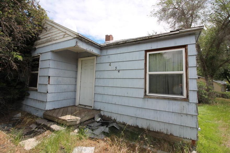 Investors this property is already gutted and just waiting for you.  Some newer windows, newer wiring and some newer plumbing.  Very large lot on the corner.  Single car garage. PLEASE BE AWARE THAT THERE ARE HOLES IN THE SUBFLOOR.  BE VERY CAUTIOUS WHEN ENTERING THE PROPERTY AND WALKING AROUND.