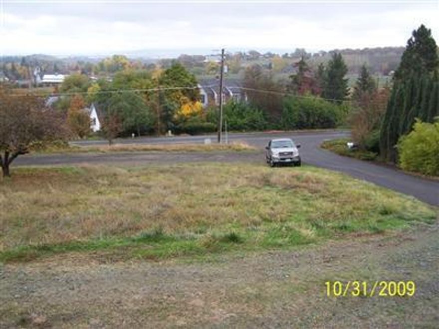 Great opportunity to build on a prime Jacksonville lot on California St. with city, valley and vinyard views! Look for signs and the orange tape that marks out the corners. This property has power, city sewer, and water available right at the street!