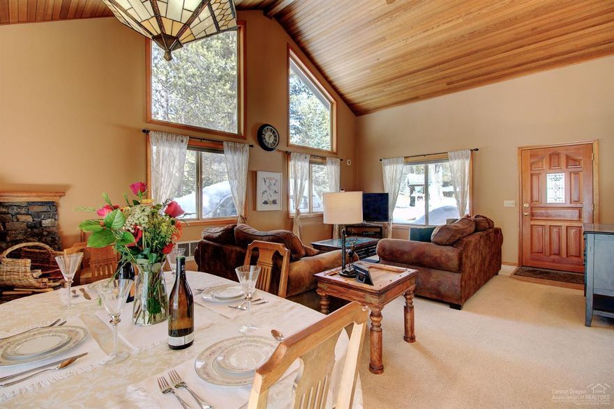 Custom built, open concept, charming home w/ vaulted ceilings right across the street from the majestic Deschutes River. This single level living home is easy to maintain w/ room for your toys, double garage, detached storage/small hobby shop w/ electricity, built in cabinets & shelves, nearly 1/2 is heated - not livable. Greenhouse attached to storage. Do not miss the insulated massive storage area in the attic w/ access through the laundry room. Your own oasis-beautifully landscaped yard w/sprinkler system installed. Home is ready for those big winter storms with heat tape installed on roof, which was replaced in 2008. Deck is prepared for your new hot tub to be installed w/ 110V Power. Great round gravel driveway, expansive windows in living room and master bedroom, RV hookups, toasty wood burning stove, & great outdoor entertaining space. Third bedroom could also be used as an office. Oregon Water Wonderland 2 community has boat access to the river, low HOA dues of $275 annually.
