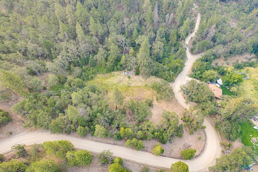Enjoy this beautiful lot tucked away in the hills of Ashland! Just 20 minutes outside of town, with RR zoning, this lot sits on 6.96 beautiful acres and offers plenty of privacy! Tucked away from the main road, this narrow piece of mostly flat and useable land brings a sense of both seclusion and solitude with plenty of potential for development. Don't miss out on this gorgeous piece of land with so much potential! Buyer to do own due diligence.