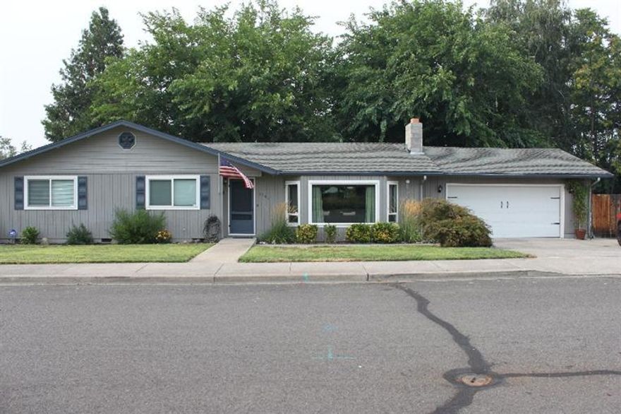 Beautiful Central Point home on a huge .25 Acre corner lot! This 3 bedroom, 2 bath home with 1,514 SqFt of living space is move-in ready and has newer roof, carpet and paint. Spacious Living Room with a fireplace. There is ample space to park your RV, boat, trailer and toys too! Fully fenced-in backyard with in-ground sprinkler system. This is a must tour!