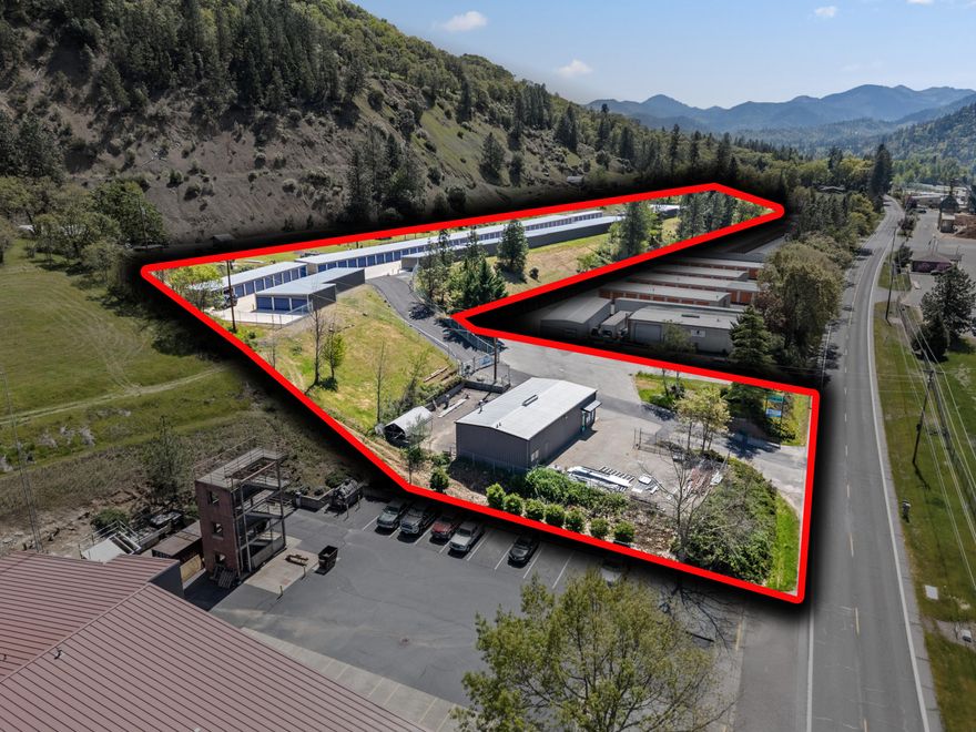 Rogue1 Self Storage is a premium 124-unit facility on 3.32 acres in scenic Rogue River. Completed in Summer 2024, leasing began in August, 2024, and as of June 18, 2025 was at 62% occupancy, with rates steadily rising. Featuring full concrete drive and aprons, block retaining walls, and high-end fencing with secure gated access. The facility is fully equipped for 100% automated operation, offering ease of management and tenant convenience. At 100% occupancy, pro-forma gross annual rents total $263,520, with actual annual operating expenses of $19,942, yielding a pro-forma NOI of $229,038 and a projected CAP rate of 7.2%. The property includes an 1,800 SF warehouse with a newly remodeled office and bathroom. Approved plans are in place for 27 additional units, 9 in the existing building, ideal for climate-controlled storage, yielding a projected $48,060 in additional gross rents annually.  With tremendous upside potential in this growing sector this is opportunity not to be missed.