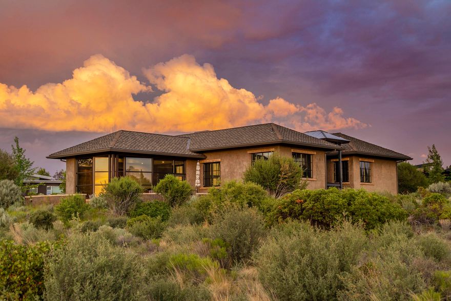 Artfully designed to maximize 180 degree mountain views, set against the majestic backdrop of Shevlin Park and the
Deschutes National Forest beyond, this Rosewood home is both unique and exceptional. Here, a rounded scheer wall,
enclosed courtyard, and west-facing glass-enclosed dining room evoke a European flair and a main level lifestyle. In the dining room you will find a wall of windows overlooking all the cascade mountains with an additional raised seating nook great for morning sunrises. This open floor plan is great for entertaining both on the main floor and downstairs with a daylight basement setting, both floors include wet bars, extensive storage and wired surround sound for all occasions. This exquisite home offers seamless granite countertops throughout, pecan wood flooring, vertical grain fir doors,
heated flooring, 3 heated zones for all season comfort, an additional office & flex space, all surrounding a beautiful courtyard with fountain.