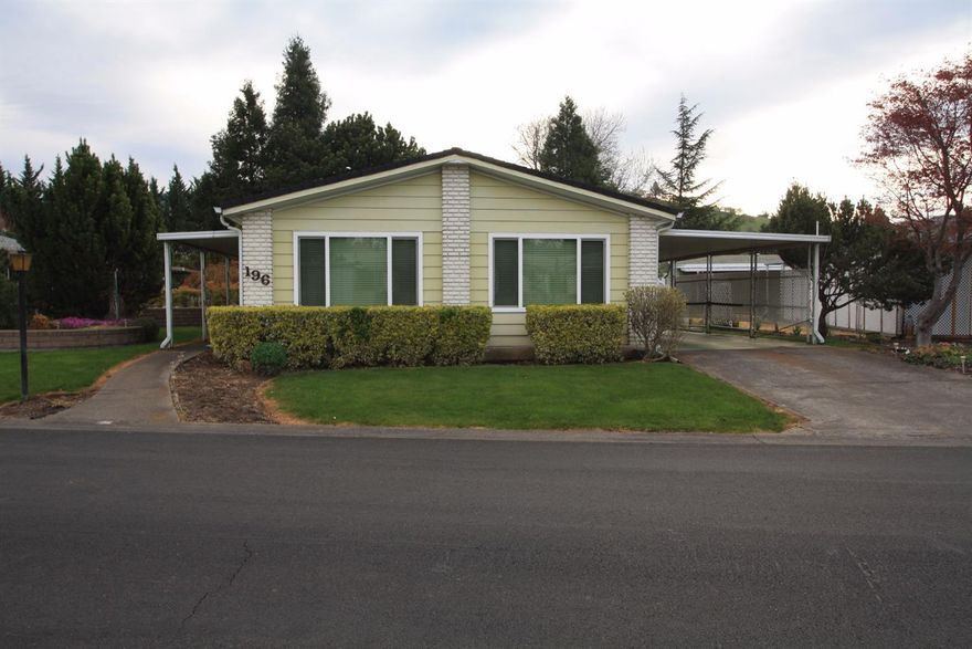 New - A very nice home in Bear Creek Estate 55+ park. This 2 bedroom, 2 bath, 1440 sq ft home has a spacious formal living room, vaulted ceilings w/nice beams & ceiling fan, dining room has built in lighted hutch w/glass doors & glass shelves, open kitchen w/double sink facing the front to enjoy the lovely spring flowers, wall oven, cook top and dishwasher, includes refrigerator, nice bench seating in eating areas & large family room w/sider to patio. The master bedroom has slider to back patio, bath has double sinks, makeup vanity, soaker tub & separate shower. Large laundry w/lots of storage. The backyard features a nice covered patio, trees & 2 large storage sheds. There is 2 car carport parking. There was a new roof installed in 2012, new vinyl windows in 2009, oven & dishwasher in 2008. The club house amenities are pool, hot tub, library, workout room, pool table & kitchen. The back of the property is marked by the park manager with stakes and an orange string marking corners