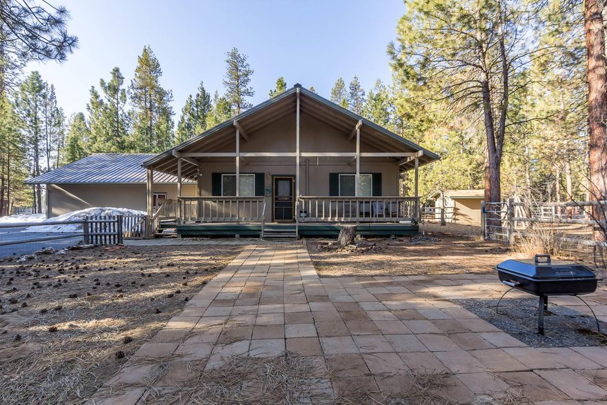 Great corner lot! Exceptional property in desirable area of La Pine. Perfect for full or part-time living. Chalet style home features a great room, 2 bedrooms & 2 full baths.  For added comfort they have installed ductless A/C & Heat in living room and both bedrooms. Covered decks front and back to enjoy the wildlife that frequent the area. Low maintenance landscaping. Fenced for pets. Paved driveway. Huge Finished 30' X 40 attached garage with 12' & 8' rollup doors w/opener & 220 Power. Separate drive through RV Garage. Woodshed, storage shed.