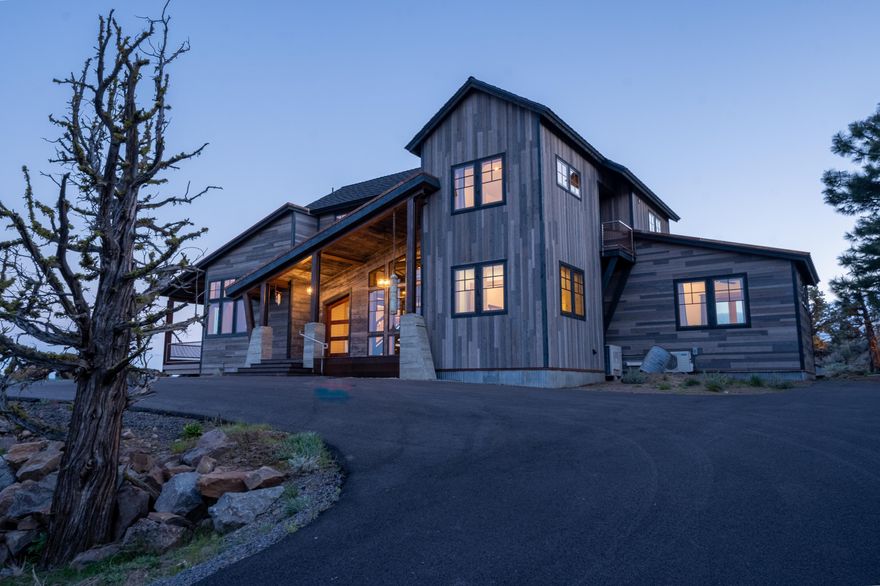 Don't miss this stunning home situated just outside of Sisters on Cloverdale Rd., inspired by a unique ''modern mineshaft'' architectural style, this custom-built residence boasts steel beam framing, an ICF-constructed basement, and radiant floor heating, with meticulously designed touches throughout. Perched atop a sheer rock bluff, it offers panoramic views of Central Oregon from Smith Rock to Pilot Butte, including the iconic Sisters mountains. The property features unparalleled privacy with potential for expansion, such as adding a workshop.

This home is not only about its robust and innovative construction but also its unique amenities, including a steel-topped kitchen island, a spacious basement ideal for a gym or additional office, and a functional dumbwaiter from a Napa Valley winery, adding a touch of historical charm.