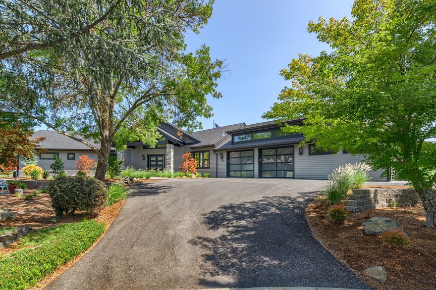 Incredible custom-built home located on the Grants Pass Golf Course. This home features 3 bedrooms, 3 bathrooms, 3235 sq ft, hickory wood floors, 50 yr roof, interior doors w/ 3 ft openings, 2 HVAC systems & LED lighting throughout. Grand living room offers high vaulted ceilings with wood beams & a 6 ft linear gas fireplace. Gorgeous kitchen with remarkable counter tops, soft close & pull-out cabinetry, subzero refrigerator & freezer & Wolf appliances. Dining area with wet bar & wine cooler. Master bedroom has sitting area & 2 walk-in closets. Luxury spa-like master bathroom with extra- long soaking tub, gorgeous tile shower with 3 shower heads & dual sinks. Large 2nd bedroom has two closets & a murphy bed. Lovely 3rd bedroom has wet bar, full bathroom & can be guest quarters with separate entrance. Amazing backyard with large covered stamped concrete patio, putting green & lawn area. Huge storage room located upstairs. Over-sized, finished 2 car garage w/ finished shop.
