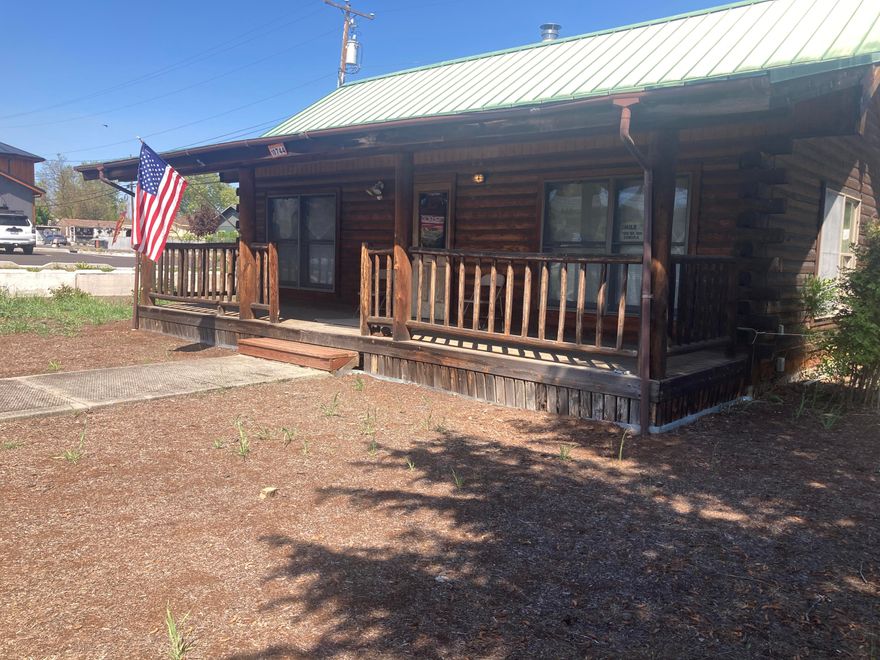 NEW PRICE! Wide range of business possibilities on this over ½ acre lot with a 600 sq. ft. office building.  Great opportunity for more development and property already has water, sewer, power, natural gas  and phone established.  Internet available and Fiber optics coming soon.  Plenty of off street paved parking.  Entrance is off Old Crater Lake Hwy, private drive and exposure from OR-62.  Nice Log office building, with open floor plan and bathroom.  This level lot is zoned C-1 (Retail Commercial District) per City of Eagle point.  On opposite side of the Hwy from Walmart.  Survey on file, check with City planning for buyer(s) due diligence and desired uses.  L/A has a financial interest in the sale.