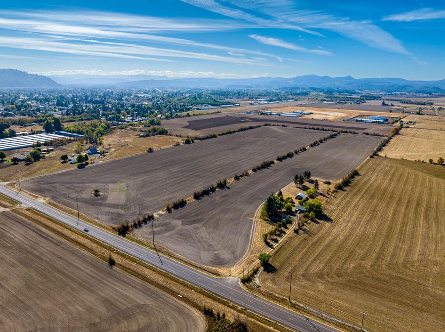 This is an excellent opportunity to own a starter farm or investment property with industrial zoning situated on 19.61 acres of land. It is conveniently located, with easy access to Albany, Corvallis, and I-5, and is also near town. The 1130 sqft house  requires some remodeling or renovating. There are multiple outbuildings on the property, to include a barn, shop, and detached two-car garage. The pasture area is fenced, making it ideal for animals. This property has a lot of potential!