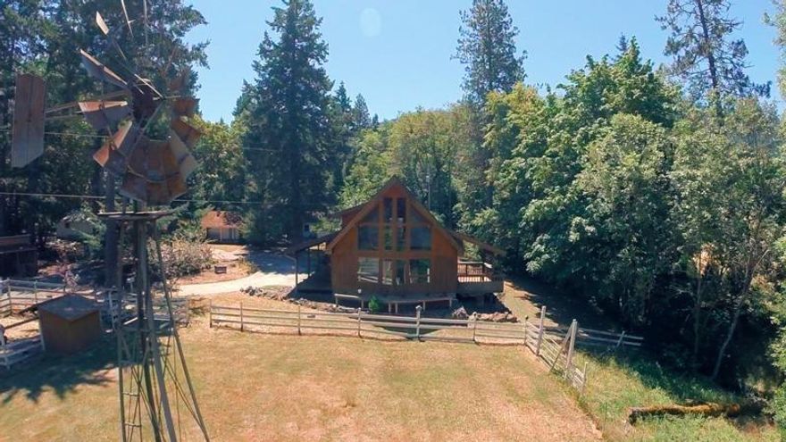 Acres of privacy, this 2 family set up has the charm of the past but the feel for a new future. 1800 sq ft Chalet over looks expansive pasture with pond for cattle, or horses. Forest, mountains and creek views. Water rights from Grays Crk. Have a second family, then see the 2 bed/2 bath nice size home. 3 out-buildings will keep you active with possible restoration. Come look, there is even an old wind mill and many antiques. Comes with Home Warranty. Sellers are motivated bring all offers.