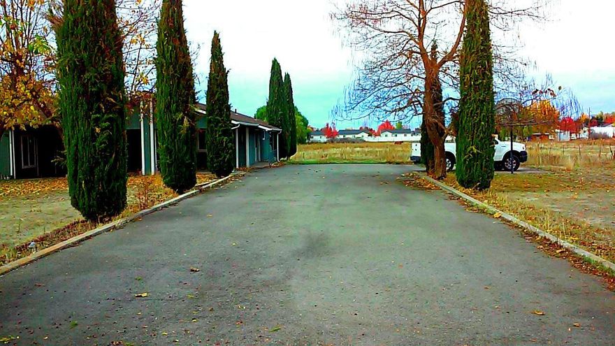 No Down - No Closing Costs - No Kidding! Big 4 Bedroom Family Home Plus Huge Bonus Room! Room for kids, pets, toys, garden, crops or ... Stretch out in this 2127 square foot 4 bedroom could be 5 bedroom stick built ranch style home. Big Family or Two Family Set Up! Central heat and air, newer insulated windows, good roof, basketball court, big bonus room that would make a great 4th bedroom master suite, 2 car carport and has both well and city water on 1.01 acres of flat, fenced and gated WCUR-6 property. That's right, Jackson County says this property can be developed. Do your due diligence. Great investment potential or perfect place to make your family dreams come true. Way Under Priced! Won't last!