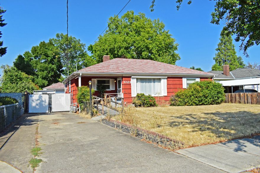1950's single-story home with 3 beds/1.5 baths, covered back porch, detached extra-long garage/shop, gated parking and fully-fenced back yard. Split floor plan with primary suite that includes a half-bath, easy access to laundry room & plenty of natural light! Brick woodburning fireplace, large picture window in front and an open common area make this home feel bigger than it is! Sizeable front & back yards get full sun and have lots of potential for a garden! Centrally located in the SW Medford area close to shopping, services, Interstate 5 & schools. Recent inspection on MLS. Great for an investor, first-time buyer or downsizer. Estate sale, seller prefers to leave all personal possession on property except for car. All offers to be submitted by 9/27/2023 @ 5pm with bid being awarded by 9/28/2023 @ 5pm