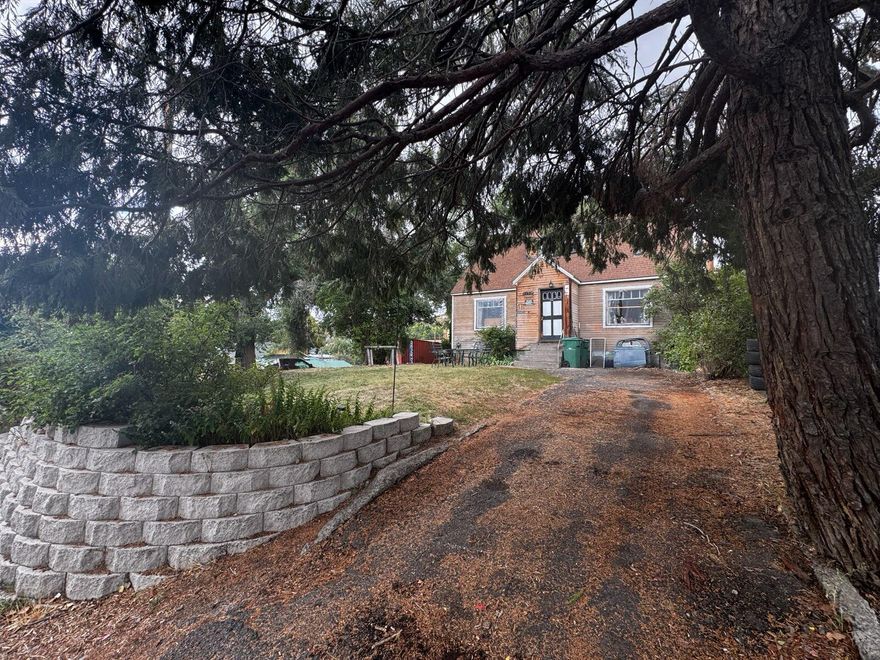 This home sits on a large lot, with a large garage area under home. Fixer upper for investors dream! Large rooms upstairs, single bedroom downstairs large living area! Call today to schedule a showing. Home sold AS IS.