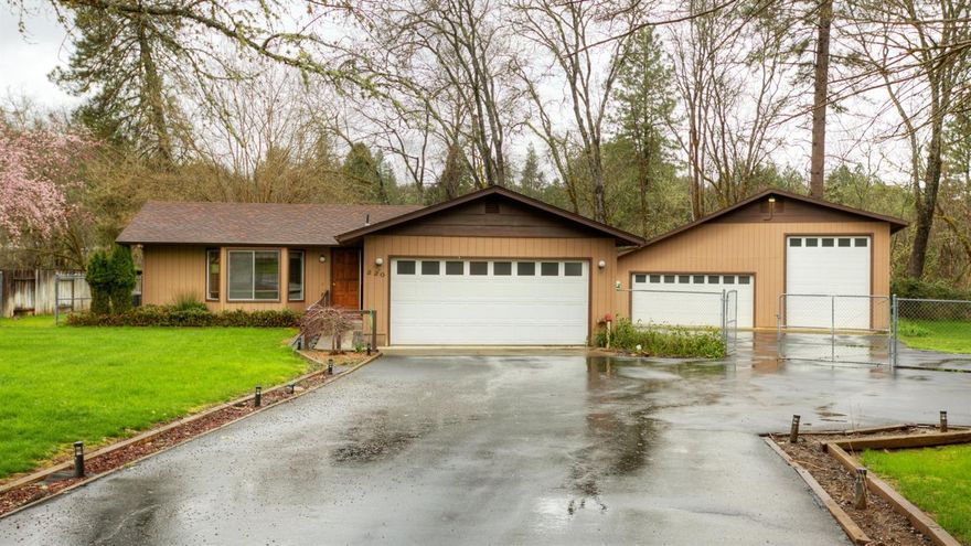 Country setting with a sweet ranch style home on 1.03 acres. Home features 2 bedrooms, 2 baths with 1,024 sf. Kitchen with snack bar, stainless steel appliances and a slider to the large covered deck with hot tub. Attached two car garage; paved driveway and RV parking. You will love the 36x36 shop/garage. Beautiful setting with seasonal creek and mature landscaping. Convenient location close to town and shopping. Low County taxes.