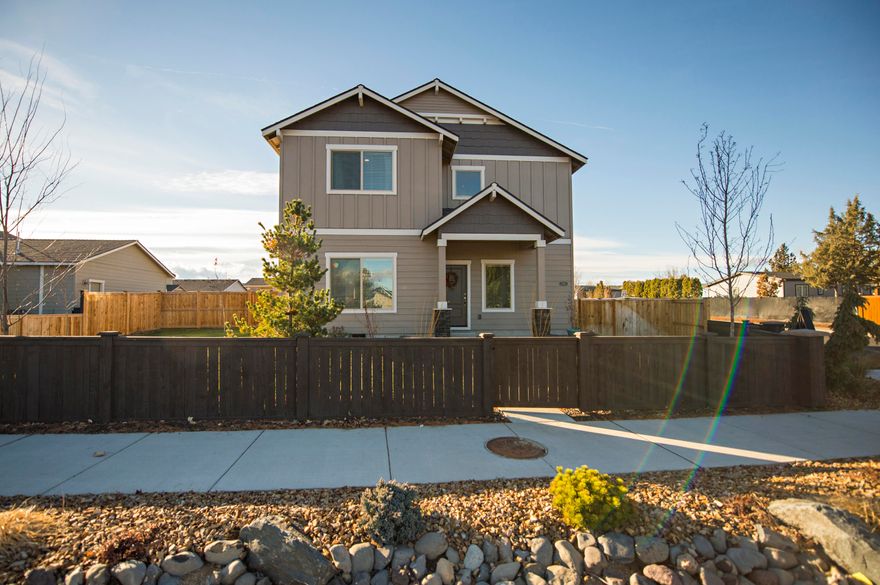 Better than new 4 bedroom, 2.5 bath home. Large bedrooms through out! Master bedroom on the main with beautiful custom barn door leading to ensuite. Kitchen features stainless appliances, quartz counters and designer hood over the island. Upstairs features a bonus room with 3 large bedrooms, storage and convenient laundry room. This well appointed home has AC for the hot summer days and a cozy gas fireplace for the winter! Fully fenced with a private side yard. The perfect location in the heart of Redmond and offers a community playground!