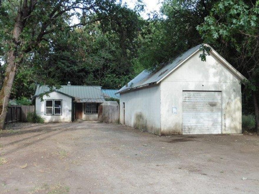 Lots of potential with this Shady Cove property situated on a large lot on a quiet street. Property offers tons of parking and a large detached shop. Inside offers 2 bedrooms and 1 bathroom and a large living room and kitchen.