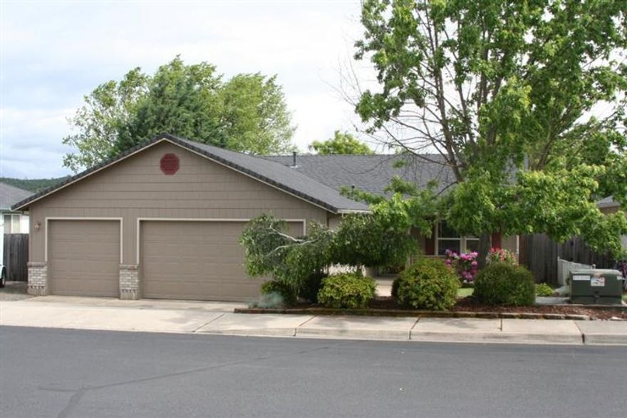 This is an adorable family home that has a large park like setting in the backyard. This open floor plan has an abundance of natural lighting and a lg kitchen that is centered for entertaining. The entry and bathroom has been updated with beautiful tile work, unique lighting fixtures in the dining room and owner has an eye for dcor. The bedrooms are spacious along with the master suite that has vaulted ceiling, art ledges, and opens to the beautiful backyard. The lg backyard has mature trees that provide a very private setting that can be viewed from kitchen and living room. There is also a play structure for the kids and plenty of room to put in your own pool. But wait there is more... a three car garage with plenty of RV parking for all your toys!