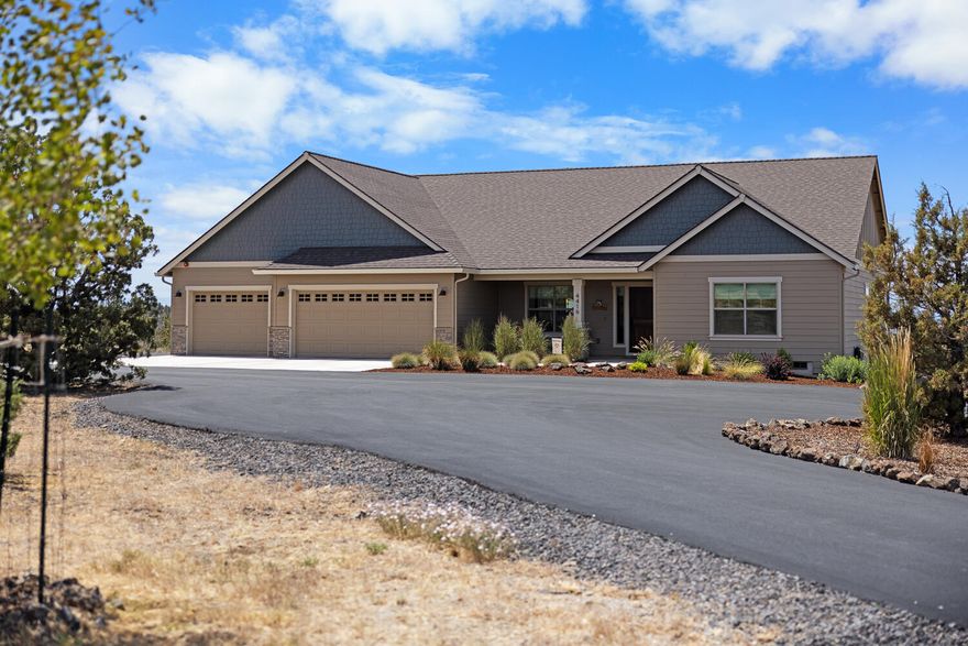 Tucked inside the gated community of Longhorn Ridge, this 4 bedroom + office, 2 and half bathrooms sits on 5.04 acres with stunning Cascade Mountain Views. Not all homes in this community allows horses - this one does! Built in 2020, this 2,886 sq ft home features a kitchen with granite countertops, a large island, vaulted ceiling, and a walk-in pantry. The great room centers around a cozy propane fireplace. Double vanities in both bathrooms, walk-in closet in the primary suite, and a large laundry room with a sink offers functional comfort. Outside, enjoy a 3 car garage with a ladder for extra storage. A paved circular drive, Rain Bird irrigation system on timers, and a 16x24 shed with concrete floors. 400 amp power - 200 to house and 200 ready for future use. Minutes to Prineville and Prineville Reservoir.