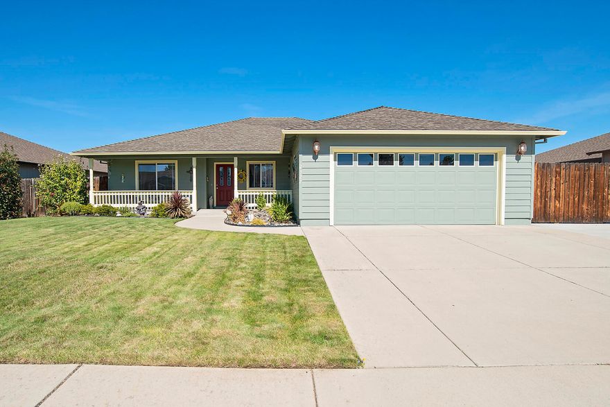 This beautiful Central Point home features 1746 sq. ft of living space with 3 bedrooms and 2 bathrooms.  The front of the home has great curb appeal and you can see long RV parking behind the gate.  Living room features a coffered ceiling.  The vaulted family room is open to the kitchen as well s dining room.  Large kitchen with hardwood floors, large island and plenty of room for counters and cabinet space.  The master bedroom ios large and has vaulted ceilings and a French door that leads outside.  Master bathroom has a double vanity  and walk in closet.  There is a finished 2 car garage.  A wonderful covered back patio to relax and watch the sun set.  This home shows the pride of ownership outside as well as insice.