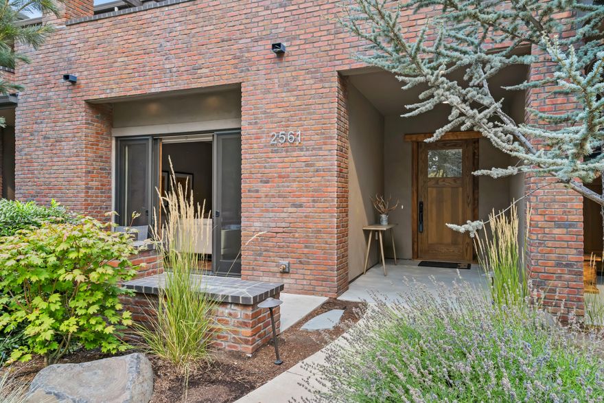 Elegant NW Contemporary townhome located in NorthWest Crossing. At 2974 SF this home is roomy and comfortable. Open and airy floor plan, tall ceilings, rustic white oak hardwood floors, honed quartz countertops in the spacious kitchen, Thermador range and hood, built-in refrigerator & pantry. Grand primary bedroom that includes sitting area with private balcony and a beautiful bath with a soaking tub, walk in tile shower and hand painted tile accents. The other 2 bedrooms have ensuite baths and direct access to a private balcony. Loft, flex space for home office or workout area. Outdoor patio with built in gas BBQ for entertaining. Organize all of your gear in the oversized 2 car garage with lots of extra storage plus a 220 EV car charger. ICF block construction and brick exterior makes this home solid and efficient. This home is a true stunner, come see it today.