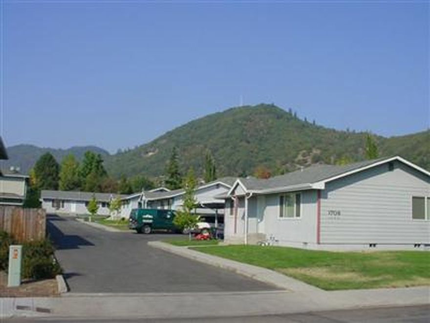 Four single family residences. Two are 1430sqft, 4BD/2BA, 2 are 2BD/1BA. Rents are $695, $855, $850 and $750. Annual income $37,800, expenses are $6,966. In Jan.1999 previous owner started a PUD application w/City. It was not completed but looks favorable to separate home and sell separately and could be worth easily $700K. They are well kept homes and easy to keep up. Location is excellent, walking distance to shopping and restaurants.