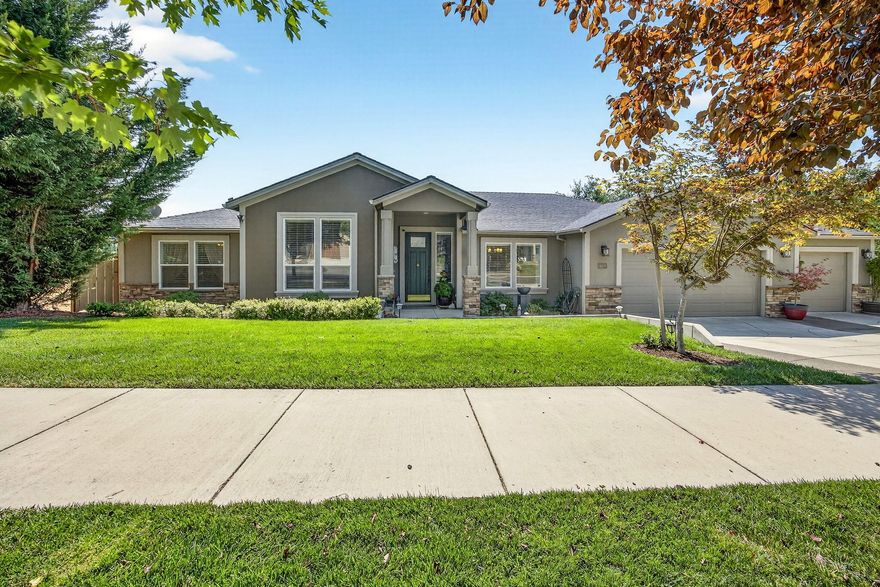 Beautiful East Hills single level home with nice views of Southern Mts and Rogue Valley. Backs up to seasonal creek. Custom built for owners w/extra amenities added. Great open floor plan w/4 bdrms, lg great rm w/a stunning gas log fireplace w/built in bookcases. French doors to a covered deck. Amazing lg kitchen w/2 pantries, granite counters w/island, gas cooktop w/built in wall oven, microwave & refrigerator. Primary suite w/ granite counters, water closet, lg tile shower and walk in closet.  Good storage in laundry rm w/washer, dryer and granite counters.  Many wide plank wood floors. Stucco exterior w/rock in front yard. Oversized 3 car finished garage w/shelves work bench + another shop/storage rm under the house with 2nd patio w/pavers to a beautiful fenced backyard w/fruit trees, night lighting and shed.