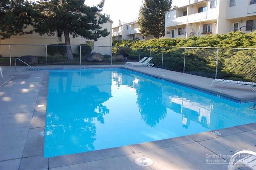 Quiet Condo Community with Pool, Clubhouse, and Hot Tub. This end unit features brand new carpet, granite counters, new tile, and refinished cabinetry. Each Master Suite has a private balcony and it's own bathroom with walk-in shower and soaking tub. Additional 16X10 loft with built-in cabinetry not included in Square Footage. Two car garage. Water, Sewer, and Gas included in HOA fee.