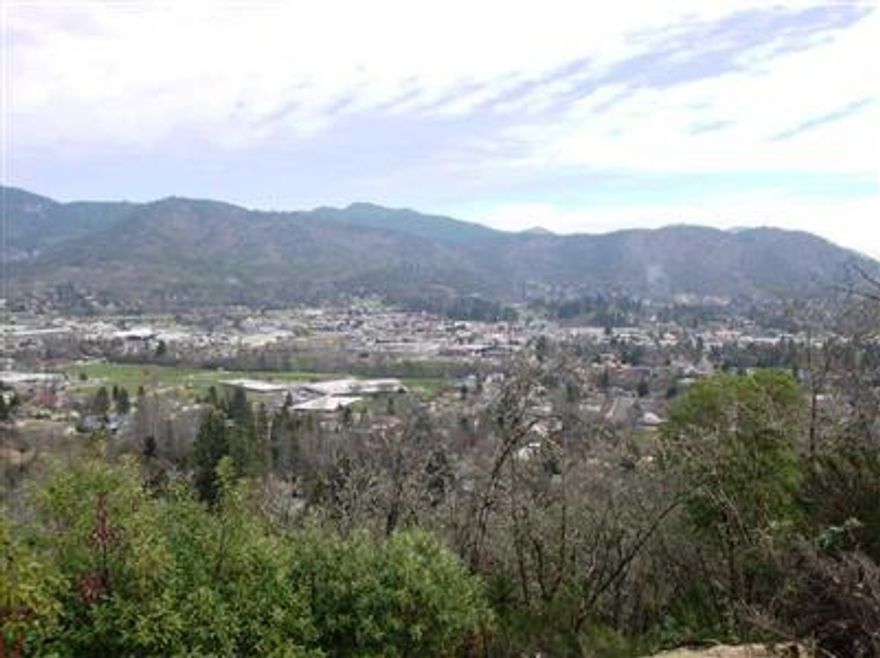 All info subject to change. Incredible city views from this gorgeous lot on one of Grants Pass' finest streets. The lot is .58 of an acre with all city services to the lot. The property already has a engineers steep slope report and views are of the city of Grants Pass and surrounding mountains. The surrounding homes are very high quality. Additional lots available. Owner willing to do trades submit all offers.