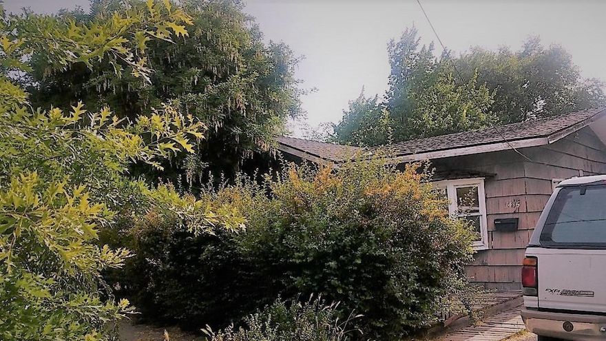 Back on the Market-2 bedroom 1 bath home, enclosed sun room and a fenced back yard. This cottage needs some TLC. Lots of potential.