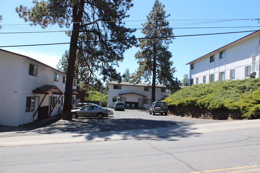 What an opportunity on the Lower Westside of Bend. 16 units with full condominium status. One block to Newport Market, one mile to COCC, and equidistant to downtown or the new OSU campus. Re-sale individually or re-develop for top dollar rents /re-sale. Lots of potential with current rents averaging $725/mo all on Mo/Mo. Set up for the highest potential with 4 buildings each with 4 units so each building could be sold as well as a 4 plex qualifying for residential financing.