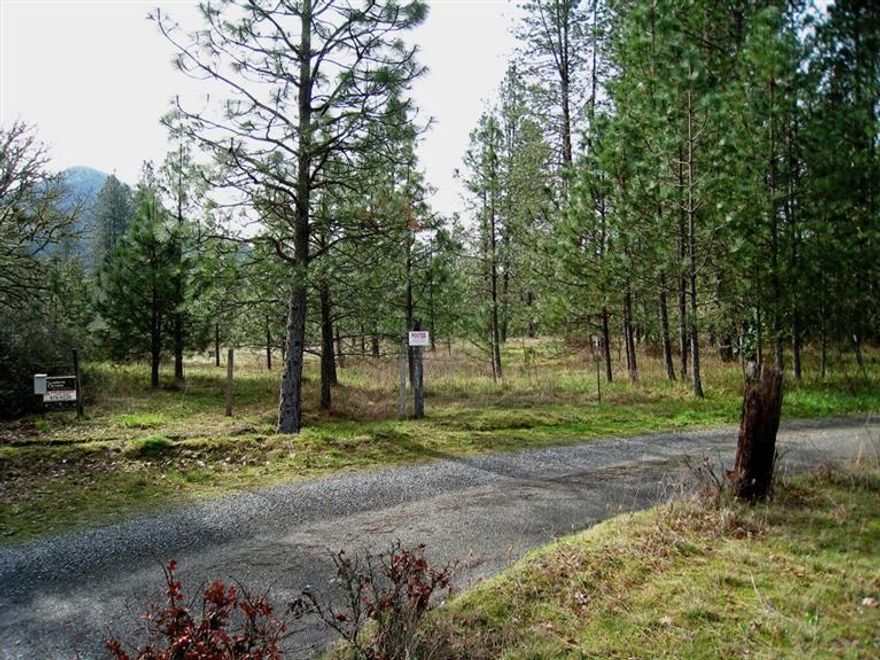 Beautiful, level parcel back off of the main road. Offering privacy and a quiet location. This property is within 3 miles of down town for easy access to shopping. This land is part wooded and part open meadows for a variety of uses. Adjacent parcel has a 10 gallon a minute well. Good water area. There is a septic system installed with a 1000 gallon concrete tank and 660 square feet of drain field. All Information is deemed reliable, but not guaranteed, & is subject to change.