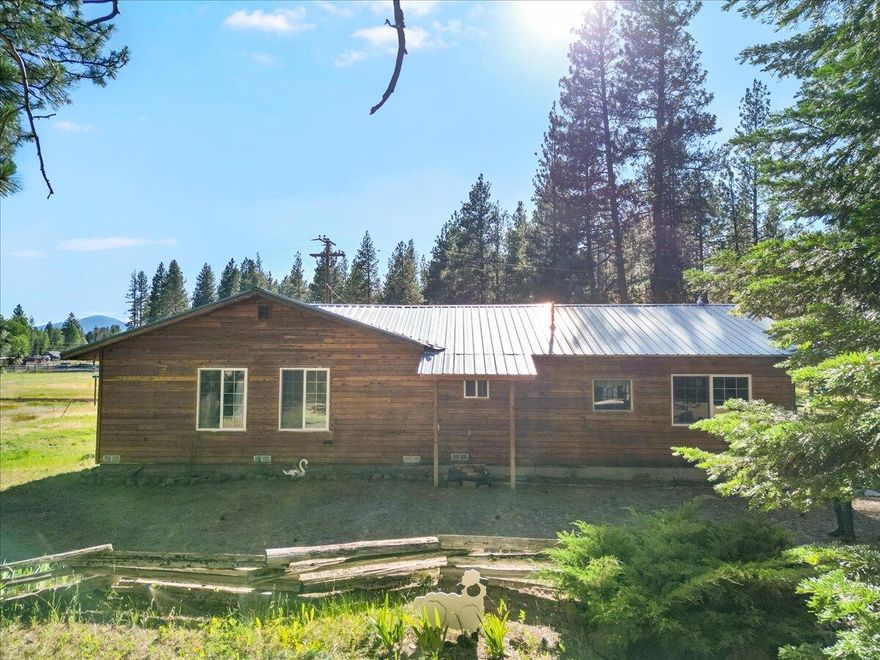 Charming Rocky Point cottage ready for your personal touch. This rustic 2 bed, 1 bath home features a metal roof, enclosed sun porches, and multiple outbuildings and shop spaces. Set on two tax lots near the renowned Klamath Lake and scenic canoe trails, the property offers access to some of the area's best fishing. Whether you're looking for a weekend retreat or your next home, this location offers both tranquility and adventure. Enjoy proximity to the City of Klamath Falls, Crater Lake National Park, and several nearby resorts with dining options. The Rogue Valley and its international airport are just a short drive away. Waterway access and the local fire department are less than a mile from the home. Adjacent to forest service land, this rural property has a Klamath Falls mailing address and is approximately 48 miles from Ashland and 31 miles from the city center of Klamath Falls.