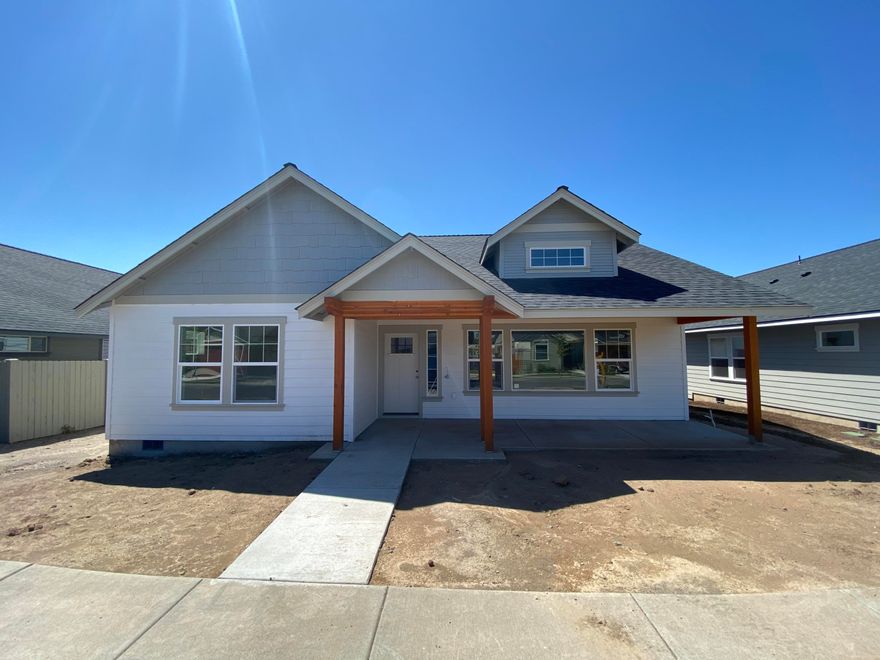 Just about completed! Stunning new custom single level energy efficient Earth Advantage certified home in the desirable Ironhorse neighborhood! Home features an expansive great room floorplan w/huge vaulted ceiling, beautiful contemporary interior finishes including white painted cabinets w/granite slab counter tops & full height tile backsplash in the nicely situated kitchen w/huge island & bar seating, SS appliances, beautiful laminate wood floors in living area w/inviting stacked stone fireplace & tv nook, carpet in bedrooms, & an amazing laundry/mud room!  The vaulted master features a spacious walk in closet, double vanity w/granite counters, & large tiled shower. Beautiful front & rear landscaping w/sprinkler system, fenced backyard, RV Parking Option, Barnes Butte Views, & huge covered front/rear patios perfect for entertaining. Great location close to Barnes Butte Trailhead, parks, Barnes Butte Elementary, & easy access to town & all of Central Oregon's amazing amenities.