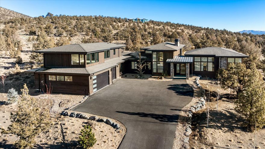 True Mountain Modern living that perfectly personifies the character of Brasada Ranch. New Construction home w/ extensive views of the majestic Cascade Mountains. Light abounds as you enter this open floor plan home which boasts a multitude of features including an open kitchen w/ a large island, stainless steel appliances, walk- in pantry, and an expansive great room that offers 16' ceilings w/ a floor to ceiling stone fireplace. The primary bedroom has private access to outdoor patio, a large walk-in closet, & spacious shower/ tub. To complete the first floor, there is an office (or bdrm), two bedrooms, full bath, & a half bath, laundry room, & oversized three-bay garage. On the second floor you will find, a loft, full bath, and a entertaining space that offers spectacular Cascade Mountain views from the windows.