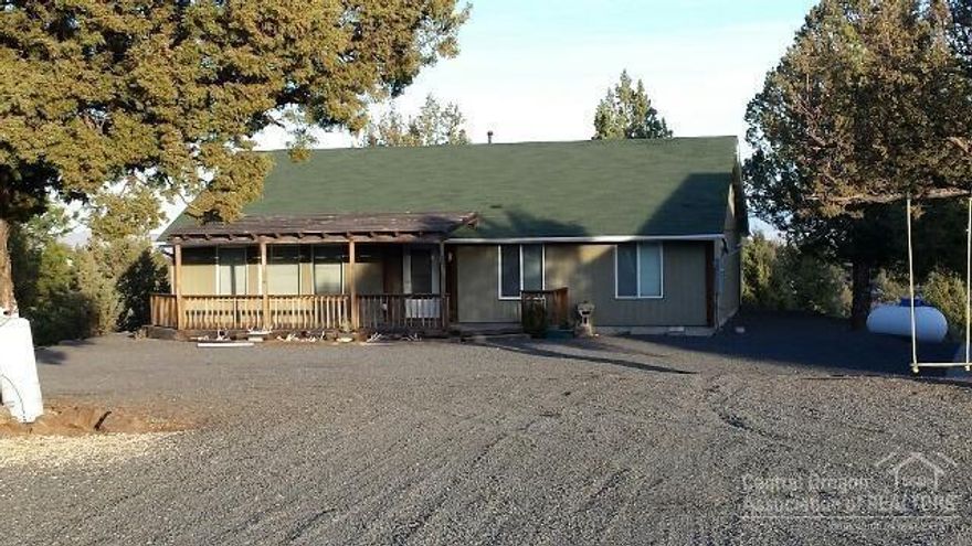 Vacation property or full time residence in 3 Rivers on Lake Billy Chinook---this property has it all. Move-in ready, front covered porch, back deck over-looking Little Canyon with expansive views. 3 B/R, 2 BA, open concept for entertaining, custom bar, & lots of storage. Large pole barn with sleeping bunk area and plenty of room to store your toys. Private well, state-of-the-art solar system, & much more. Price includes a $2,500 flooring allowance. Call today for appt.