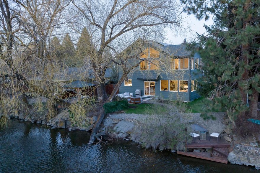 Nestled in the heart of Bend, Oregon, this stunning riverside property offers not only a serene escape but also unparalleled convenience.  Imagine living just moments away from downtown, the Old Mill District, Galveston Ave., Newport Ave. parks, trails and so much more.  

Boasting 4 generous sized bedrooms and 3 beautifully appointed bathrooms, this home provides ample space for relaxation and rejuvenation.  The spacious primary suite exudes luxury, comfort and overlooks the river.  The home floorplan flows seamlessly, with a lot of flexibility of space and different features to fit every phase of life.  Updated to perfection, this retreat features expansive windows offering breathtaking views of the Deschutes River.  

The allure of this home extends beyond its walls, as it offers direct access to the Deschutes River via its grandfathered dock, grassy yard, paver patio and private hot tub.
