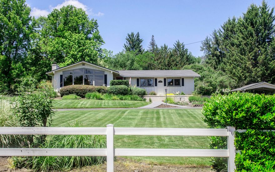 Beautiful view property in a park-like setting just outside of Jacksonville. Comfortable, spacious, well-maintained home with inviting views in all directions. Large living room with vaulted ceiling, gas fireplace, windows overlooking city lights, Mt McLoughlin & mountains. Gracious country kitchen with island, Corian & maple butcher-block countertops, lots of cupboards & gas stove. French doors to sun room is a cozy peaceful hide-away. Separate laundry room off kitchen with additional storage. Master suite with access to backyard; master bath with air-jet soaking tub, 3'x5' shower, double vanities & separate water closet. Sprawling backyard with attractive in-ground pool is a lovely private oasis. Outbuildings include workshop with gas heat, office with skylight, pool house & storage. Underground sprinklers & drip system. Room for vegetable garden. Good private well (7gpm/2012), MID irrigation & public sewer. Refrigerator, washer, dryer included. Jacksonville Elem. 1-yr home warranty.